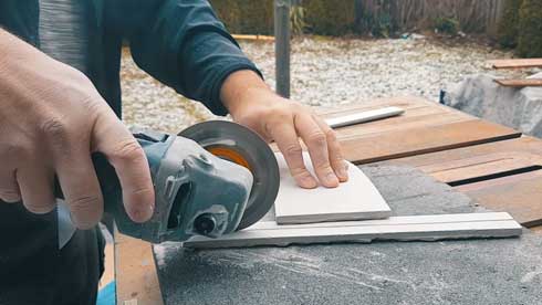 Angle grinder with stone blade attached