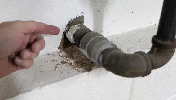 What do you use to seal a concrete septic tank pipe